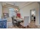 Bright dining room with chandelier, wood floors, and ample natural light at 7905 Brent Leaf Ave, Las Vegas, NV 89131