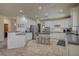 Spacious kitchen featuring white cabinets, stainless steel appliances, and tile flooring at 7905 Brent Leaf Ave, Las Vegas, NV 89131