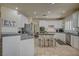 Well-lit kitchen with tile floors, stainless steel appliances, and ample counter space at 7905 Brent Leaf Ave, Las Vegas, NV 89131