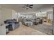 Open living room showcasing a large seating area with a fireplace and open flow to the kitchen at 7905 Brent Leaf Ave, Las Vegas, NV 89131