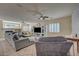 Comfortable living room with fireplace, large sectional, and stylish accents at 7905 Brent Leaf Ave, Las Vegas, NV 89131