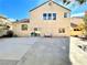 Backyard of the house with covered patio area and some green trees at 880 Glitter Glen Ct, Las Vegas, NV 89123