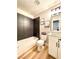 Bathroom with modern vanity, wood-look floor and tiled shower at 880 Glitter Glen Ct, Las Vegas, NV 89123