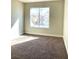 Bedroom features carpeting, neutral walls, and plenty of natural light at 880 Glitter Glen Ct, Las Vegas, NV 89123