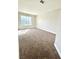 Bedroom featuring neutral walls, carpeting, and a bright window at 880 Glitter Glen Ct, Las Vegas, NV 89123