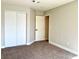 Bedroom featuring neutral walls, carpeting, and a closet at 880 Glitter Glen Ct, Las Vegas, NV 89123