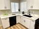 Modern kitchen with white cabinets, quartz countertops, and stainless steel appliances at 880 Glitter Glen Ct, Las Vegas, NV 89123