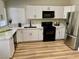 Bright kitchen featuring white cabinets, stainless steel appliances, and modern countertops at 880 Glitter Glen Ct, Las Vegas, NV 89123