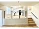 The living room overlooks a modern kitchen and staircase at 880 Glitter Glen Ct, Las Vegas, NV 89123