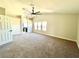 Spacious primary bedroom with neutral walls, carpet, and bright windows at 880 Glitter Glen Ct, Las Vegas, NV 89123