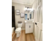 Well-lit bathroom with a white vanity, vessel sink, and modern fixtures at 880 Glitter Glen Ct, Las Vegas, NV 89123