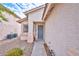 Inviting front entrance with security screen door and manicured desert landscaping at 9005 Meisenheimer Ave, Las Vegas, NV 89143