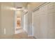 Hallway with a closet, tile floors, and doors leading to other rooms of the house at 9005 Meisenheimer Ave, Las Vegas, NV 89143