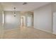 Neutral open-concept living space with tile floors and abundant natural light at 9005 Meisenheimer Ave, Las Vegas, NV 89143