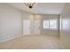 Neutral open-concept living space with tile floors and abundant natural light at 9005 Meisenheimer Ave, Las Vegas, NV 89143