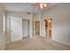 Main bedroom with ceiling fan, carpet, closet, and ensuite bathroom access at 9005 Meisenheimer Ave, Las Vegas, NV 89143