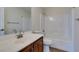 Bathroom with a tub and shower combo, a white countertop, and dark wood cabinets at 9102 Brilliant Prairie Ct, Las Vegas, NV 89149