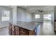 Granite island with dark wood cabinets, a ceiling fan, and sliding glass doors opening to the backyard at 9102 Brilliant Prairie Ct, Las Vegas, NV 89149