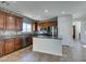 Well-equipped kitchen featuring stainless steel appliances, granite countertops, and mosaic tile backsplash at 9102 Brilliant Prairie Ct, Las Vegas, NV 89149