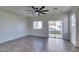 Cozy living area featuring modern fan, tile floors, and backyard access at 9102 Brilliant Prairie Ct, Las Vegas, NV 89149