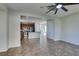 Bright living room featuring tile flooring, ceiling fan, and open access to the kitchen at 9102 Brilliant Prairie Ct, Las Vegas, NV 89149