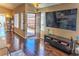 Inviting entryway with hardwood floors and lots of natural light from the windows at 951 Carnival Ave, Las Vegas, NV 89123