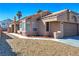 Single-story home boasts a well-manicured xeriscaped yard and attached two car garage at 951 Carnival Ave, Las Vegas, NV 89123