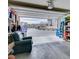 Spacious garage interior with an open door and a view of the neighborhood, with a large arm chair at 712 N Water St, Henderson, NV 89015