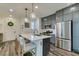 Modern kitchen featuring a center island with seating, stainless steel appliances, and sleek cabinetry at 712 N Water St, Henderson, NV 89015