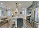 Kitchen with a large island with seating, stainless steel appliances, and modern cabinetry at , Henderson, NV 89015