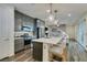 Kitchen with a central island, stainless steel appliances, and an open layout into the living area at 712 N Water St, Henderson, NV 89015