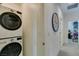 Convenient laundry area features stacked washer and dryer, with hallway and additional storage at , Henderson, NV 89015