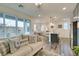 Inviting living room featuring modern furnishings, an open floor plan, and large sliding glass doors at 712 N Water St, Henderson, NV 89015