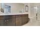 Spacious main bathroom featuring a double vanity, modern cabinets, and a glass shower at 712 N Water St, Henderson, NV 89015