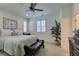 Spacious main bedroom featuring bright natural light, a ceiling fan, and a plush king bed at , Henderson, NV 89015