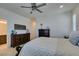 Bright main bedroom with natural light and classic wood furniture and a dark upholstered bench at , Henderson, NV 89015