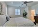 Spacious main bedroom featuring bright natural light, a ceiling fan, and a plush king bed at , Henderson, NV 89015