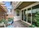 Cozy patio space with a pergola, comfortable seating, and sliding glass doors leading to the interior at 712 N Water St, Henderson, NV 89015