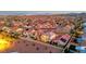 Overhead view of the community showcasing well-manicured lawns, shimmering pools, and solar panels at 10184 Fire Skye Ave, Las Vegas, NV 89166