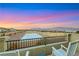 Balcony view overlooking a sports park and the desert landscape at sunset at 10184 Fire Skye Ave, Las Vegas, NV 89166