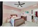 Bright bedroom features pink walls, wood floors, and a charming decor at 10184 Fire Skye Ave, Las Vegas, NV 89166