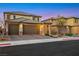 Beautiful two-story home with attached three-car garage and well maintained landscaping at 10184 Fire Skye Ave, Las Vegas, NV 89166