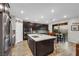 Beautiful open kitchen featuring quartz countertops, stainless appliances, and a dining area perfect for entertaining guests at 10184 Fire Skye Ave, Las Vegas, NV 89166