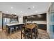 Kitchen featuring stainless steel appliances, an island, and dark cabinets at 10184 Fire Skye Ave, Las Vegas, NV 89166