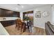 Kitchen features a table, dark cabinets, and stainless steel appliances at 10184 Fire Skye Ave, Las Vegas, NV 89166