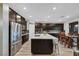 Bright kitchen with stainless steel appliances, quartz countertops, backsplash, and ample storage for cooking and entertaining at 10184 Fire Skye Ave, Las Vegas, NV 89166