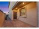 Charming front patio with brick pavers, perfect for enjoying the outdoors at 10184 Fire Skye Ave, Las Vegas, NV 89166