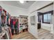 Spacious walk-in closet with custom shelving and ample storage for clothes and shoes at 10184 Fire Skye Ave, Las Vegas, NV 89166