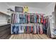 Organized walk-in closet featuring ample hanging space, shelving, and storage for a well-curated wardrobe at 10184 Fire Skye Ave, Las Vegas, NV 89166