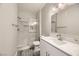 Bathroom with a white vanity, quartz countertop, glass shower door, and modern fixtures at 1050 E Cactus Ave # 1049, Las Vegas, NV 89183